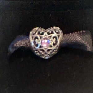 Pandora “Filled with Romance” silver/purple charm.